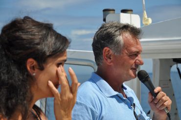 From the boat Le Grand Bleu, Patrick Flores inaugurates the brand new anti-shark net of Boucan Canot. It’s a historical and emotional moment © Andy Guinand / OCEAN71 Magazine