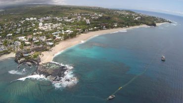 The beach of Boucan Canot was hit several times by tragic shark attacks. Today, the surf spot and a large swimming area are protected by an innovative netting system © Andy Guinand / OCEAN71 Magazine